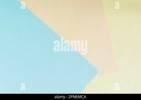 Paper colored pastel background. Light beige, blue, yellow in geometric composition top view. Abstract colorful background. Gentle calm color for the Stock Photo