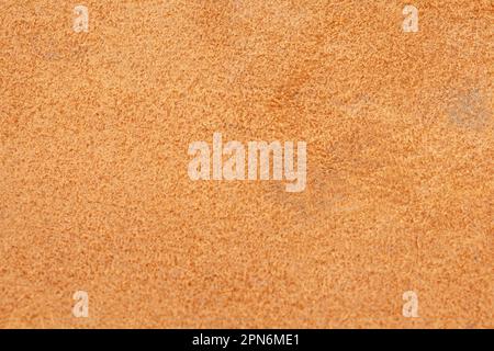 Light beige matte background of suede fabric, closeup Stock Photo