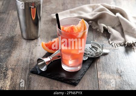 Sea breeze cocktail in glass on wooden table Stock Photo