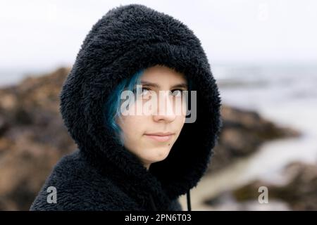 Portrait of a pretty teenage girl wearing leggings and a fluffy jumper  Stock Photo - Alamy