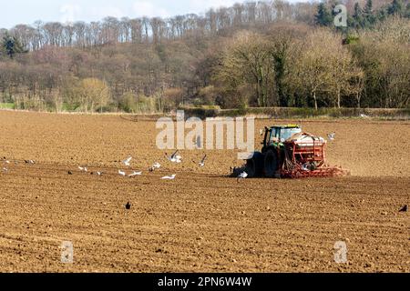 A tractor at work in a Scottish field Stock Photo