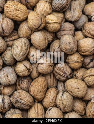 Walnuts in shell at the market stall. Abruzzo, Italy, Europe Stock Photo