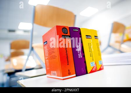 Oldenburg, Germany. 17th Apr, 2023. Several dictionaries stand on a table at the Graf-Anton-Günther-Schule (GAG) before the start of the written Abitur exams in history. In Lower Saxony, the final exams for the 2023 Abitur class will begin. The exams in various subjects will be written by May 9, 2023. Credit: Hauke-Christian Dittrich/dpa/Alamy Live News Stock Photo