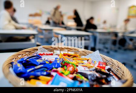 Oldenburg, Germany. 17th Apr, 2023. A basket of various sweets stands on a table at the Graf-Anton-Günther-Schule (GAG) before the start of the written Abitur exams in history. In Lower Saxony, the final exams for the 2023 Abitur class will begin. The exams in various subjects will be written by May 9, 2023. Credit: Hauke-Christian Dittrich/dpa/Alamy Live News Stock Photo