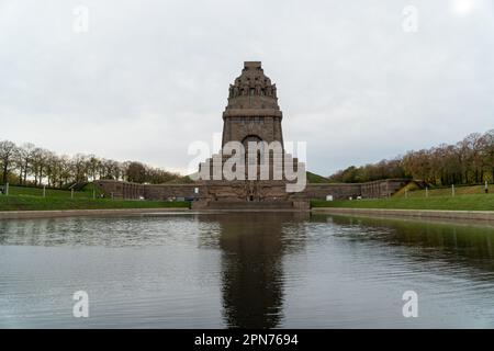 LEIPZIG, GERMANY – NOVEMBER 24, 2022: The gigantic monument Battle of the Nations in Leipzig with artificial lake in front and tall statues inside Stock Photo