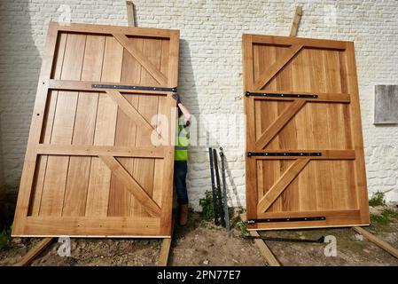 Leconfield estate workmen from Petworth, West Sussex assemble the new North gate at Hougoumont in April 2015, ahead of the bi-centenary in June Stock Photo