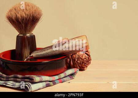 Natural shaving equipment, blade, brush and towel and the nature cone in the bath. Barbershop theme backgrounds. Copy space for text Stock Photo