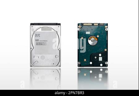 Close up front and back of hard disk drive 2.5 inch isolated on white background with reflection, computer parts concept. Stock Photo