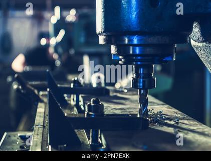 Closeup of Drill Bit of CNC Milling Machine During Operation. Metalworking Industry Theme. Stock Photo