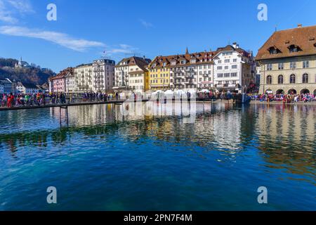 Lucerne, Switzerland - February 20, 2023: Scene of streets crowded with participant and others, some in costumes, during the Fasnacht Carnival, in Luc Stock Photo