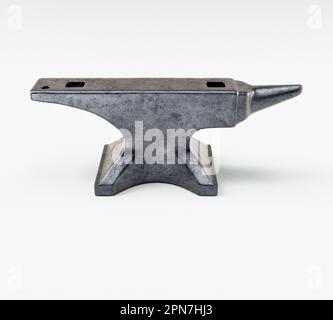 A heavy iron blacksmiths anvil on an isolated white studio background - 3D render Stock Photo