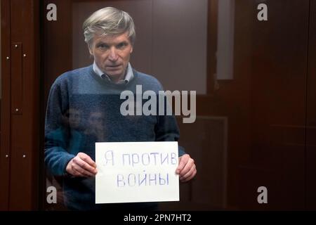 FILE - Alexei Gorinov Holds A Sign "I Am Against The War" Standing In A ...