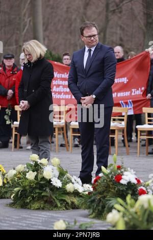 Nordhausen, Germany. 17th Apr, 2023. The Federal Government Commissioner for East Germany, Carsten Schneider (SPD), lays flowers during a commemoration ceremony marking the 78th day of the liberation of the Mittelbau-Dora concentration camp. U.S. troops had reached the camp on April 11, 1945. Since the date this year coincided with the Jewish Passover, the commemoration will be held a little later this year. held a little later. Credit: Matthias Bein/dpa/Alamy Live News Stock Photo