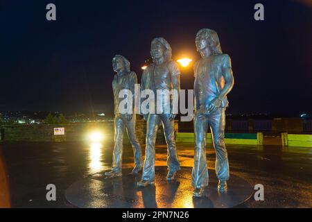 Bronze statue of the Bee Gees pop group by Andy Edwards, 2021, Loch Promenade, Douglas, Isle of Man Stock Photo