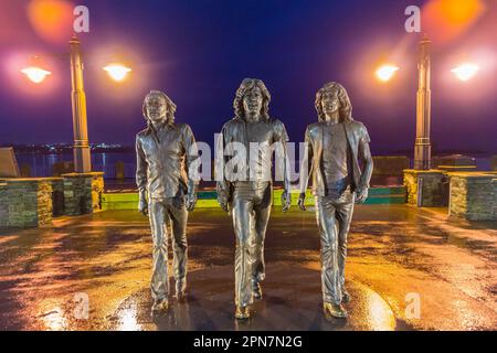 Bronze statue of the Bee Gees pop group by Andy Edwards, 2021, Loch Promenade, Douglas, Isle of Man Stock Photo