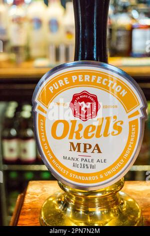 Okell's brewery pump clips on the bar of the Terminus Tavern, Strathallan crescent, Douglas, Isle of Man. Okell's MPA Manx Pale Ale. Stock Photo