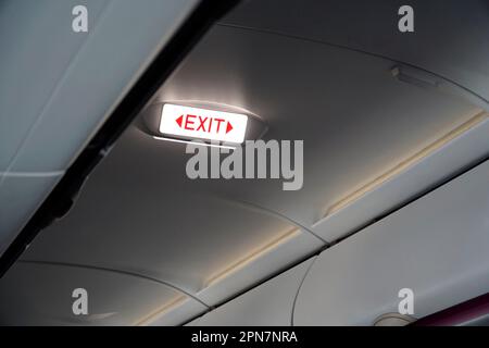 Emergency exit sign inside an airpane Stock Photo