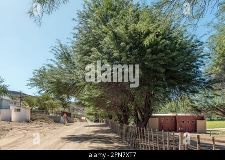 Boegoeberg Dam, South Africa - Feb 28 2023: View of the holiday resort at Boegoeberg Dam. An abluition building is visible Stock Photo