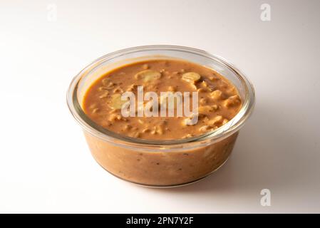 Stroganoff stored in glass bowl isolated on white background Stock Photo