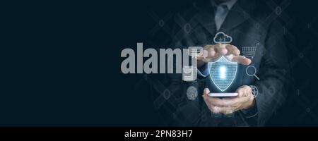 Securely Navigating the Digital World: Businessman's Hand Holds Smartphone with Virtual Shield Icon and Internet Icons for Protection. Stock Photo