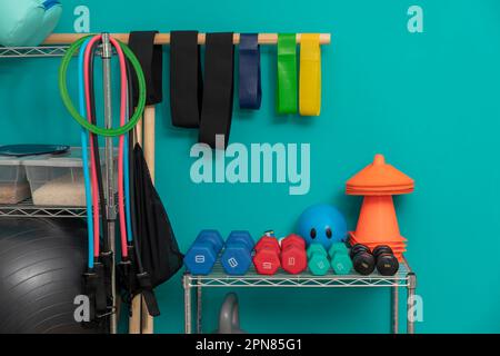 Equipment for exercising, in a physiotherapy clinic, with dumbbells, balls, ropes and leagues. Stock Photo