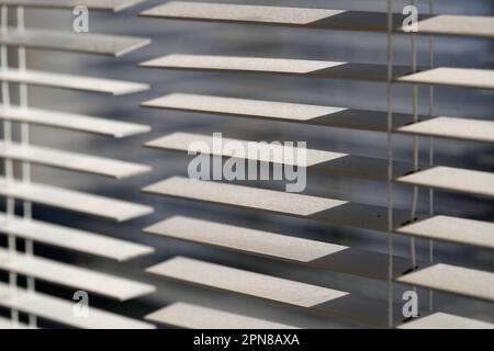 Sunlight coming through venetian blinds by the window. Stock Photo