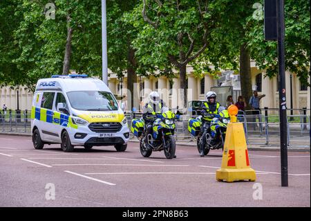 LONDON - May 18, 2022: Law enforcement keeps watch on The Mall with their motorcycles and van. Stock Photo