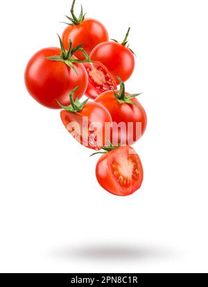 Small red cherry tomatoes floating on white background. Stock Photo