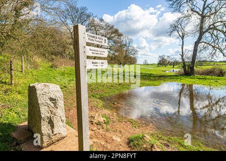 The start of the Thames Path long distance walking trail at the source of the River Thames at Thames Head on the Cotswolds near Kemble, Gloucestershir Stock Photo