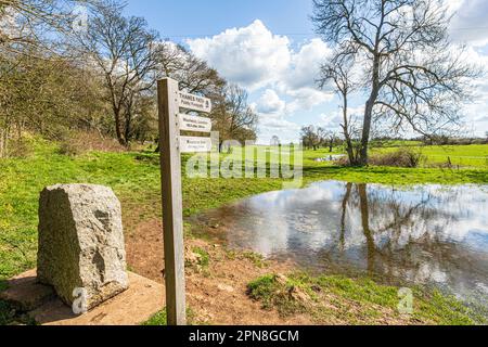 The start of the Thames Path long distance walking trail at the source of the River Thames at Thames Head on the Cotswolds near Kemble, Gloucestershir Stock Photo