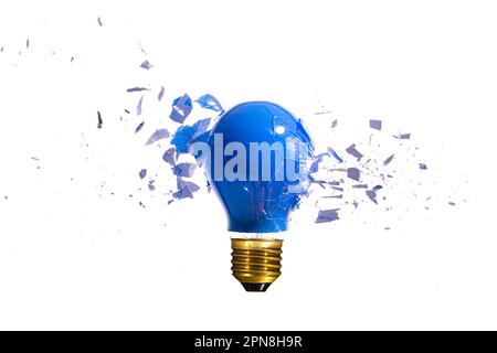 traditional blue light bulb breaks on the white background Stock Photo