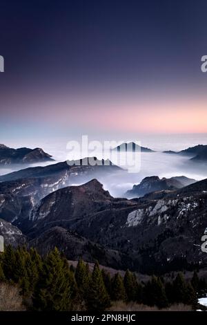 Vicenza Pre-Alps. From left to right: the Tonezza del Cimone plateau, Mount Tormeno and the slopes of Mount Toraro. Arsiero, Veneto, Italy. Stock Photo