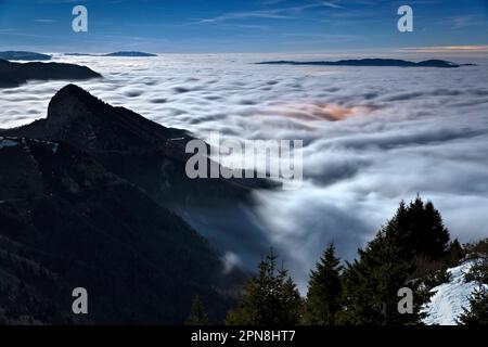 Monte Spitz Tonezza emerges from the mists on a moonlit night. Tonezza ...