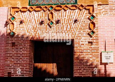 Casa del Aljimez - Aljimez House. Mudejar house from the 15th century. Facade with exposed brick and arabesques, sgraffito, and window, mullion, with Stock Photo