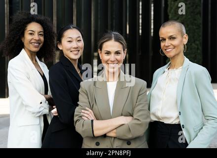 Multiracial group of successful confident women office corporate professional experts. Female team smiling looking at camera. Business concept Stock Photo