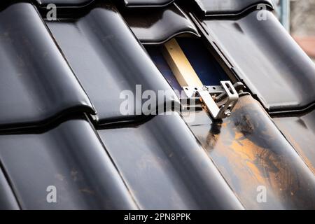 Mounting bracket for solar panels on a tile roof Stock Photo