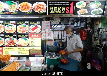 Traditional Asian food stall in Singapore Food Trail hawker center.  Singapore. Stock Photo