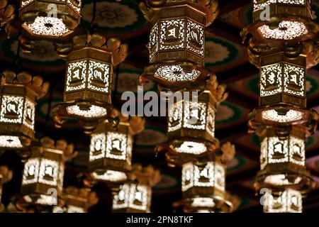 Buddha Tooth Relic Temple. Golden lanterns lining the ceiling. Singapore. Stock Photo