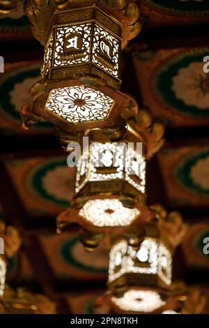 Buddha Tooth Relic Temple. Golden lanterns lining the ceiling. Singapore. Stock Photo