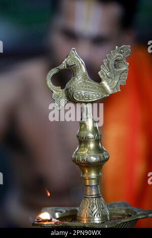 Sri Srinivasa Perumal hindu temple.  Indian traditional Samai or Samayee, a typical shape of diya (lamp) usually made up of brass. Singapore. Stock Photo