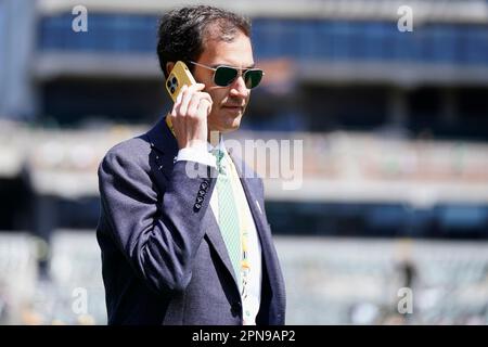 Oakland Athletics president Dave Kaval, left, talks to Reggie