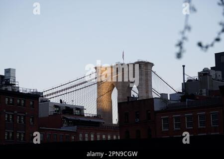Last light on Brooklyn Bridge, seen from lower Manhattan, New York City. Stock Photo