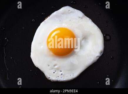 Fried egg in a frying pan. Stock Photo