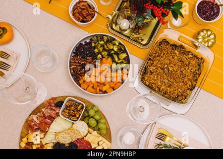 Top view of the table with Thanksgiving dishes and decor, celebration Stock Photo