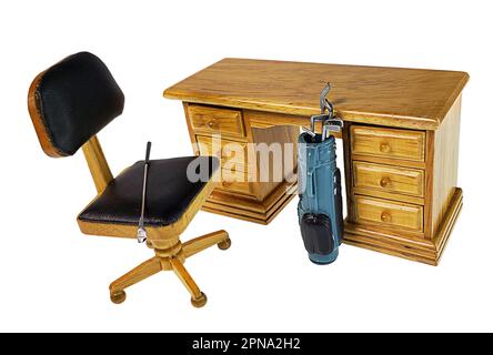 Golf clubs and carrier next to desk waiting for after hours Stock Photo