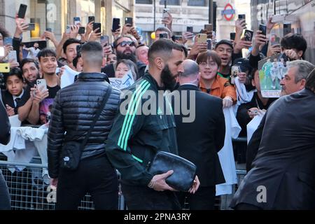 London, UK. 17th Apr, 2023. Real Madrid's Karim Benzema walks past a group of fans. The team's players leave their hotel for a press conference and training session ahead of the quarter-finals of the Champions League where they face Chelsea on Tuesday evening at Stamford Bridge. Credit: Eleventh Hour Photography/Alamy Live News Stock Photo