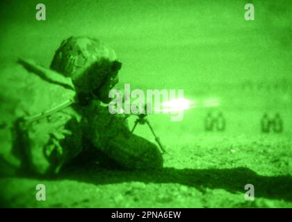 UNDISCLOSED LOCATION, Calif. (April 4, 2023) A West Coast-based Naval Special Warfare operator conducts nighttime live-fire weapons training using a MK-18 M4 carbine rifle as part of land warfare training exercises. Naval Special Warfare is the nation’s elite maritime special operations force, uniquely positioned to extend the Fleet’s reach and gain and maintain access for the Joint Force in competition and conflict. (U.S. Navy photo by Mass Communication Specialist 1st Class Chelsea D. Meiller 230404-N-GR718-3742 Stock Photo