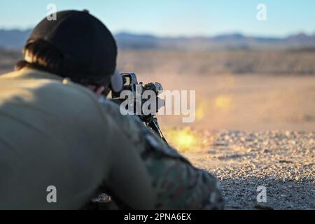 UNDISCLOSED LOCATION, Calif. (April 4, 2023) A West Coast-based Naval Special Warfare operator conducts land warfare live-fire weapons training using a MK-18 M4 carbine rifle. Naval Special Warfare is the nation’s elite maritime special operations force, uniquely positioned to extend the Fleet’s reach and gain and maintain access for the Joint Force in competition and conflict. (U.S. Navy photo by Mass Communication Specialist 1st Class Chelsea D. Meiller 230404-N-GR718-2638 Stock Photo