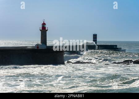 Oporto, Portugal. February 15, 2023. Atlantic Ocean and a lighthouse in Oporto Stock Photo