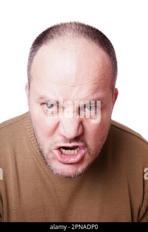 middle aged man with a mad expression on his face shouting Stock Photo